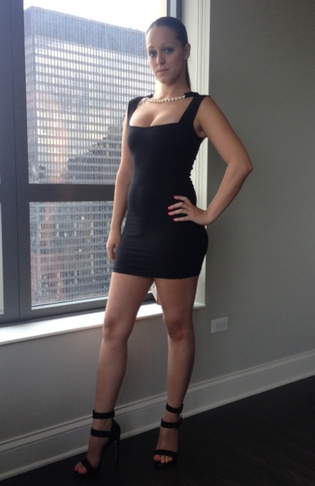 Black mini dress with faux pearl and crystal neck.